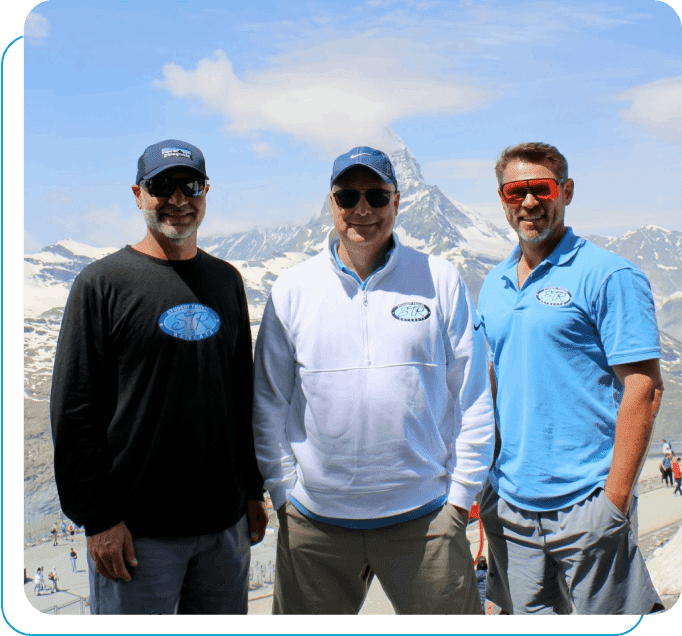 The three Student Travel Retreats founders together in front of the Matterhorn