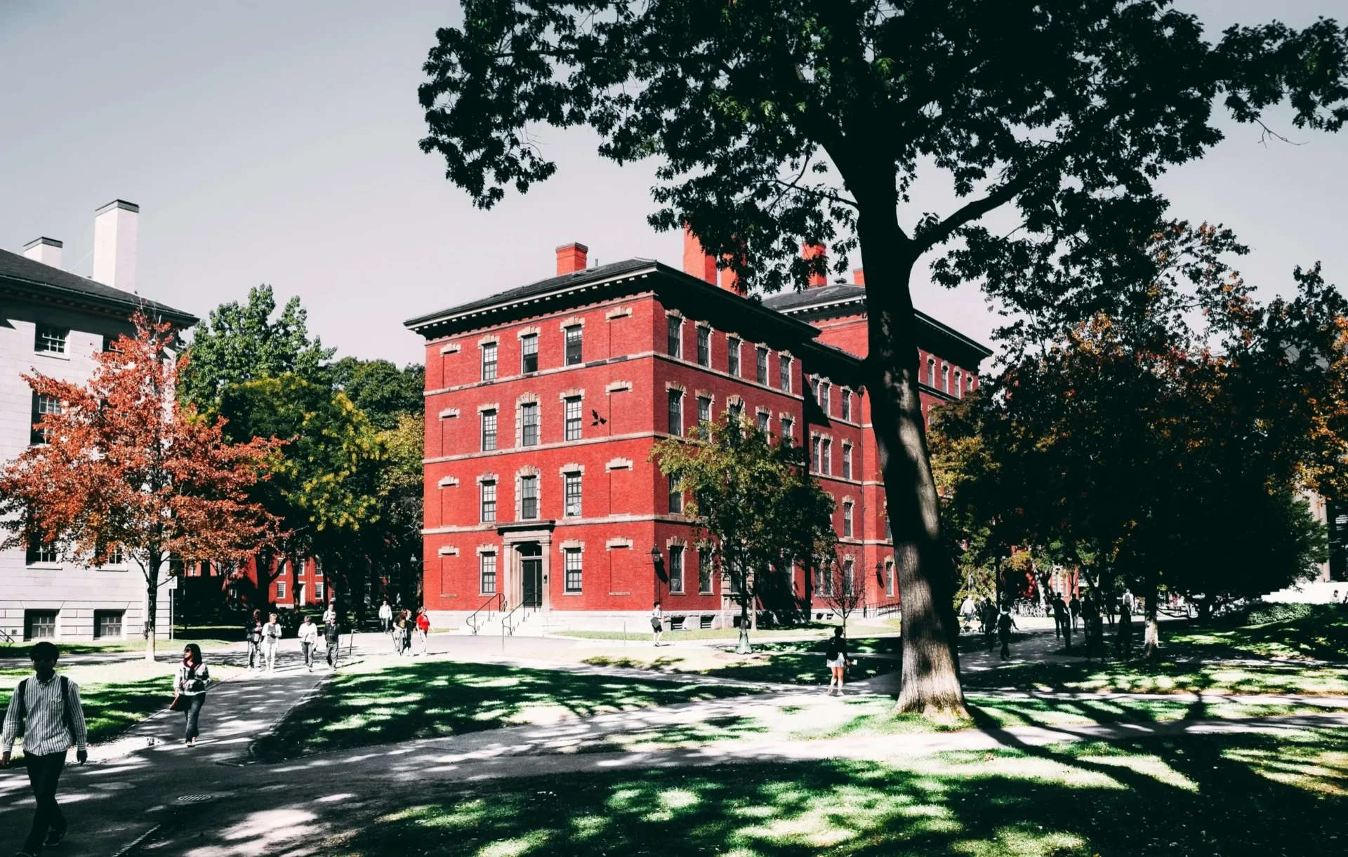 A red building with trees in the background