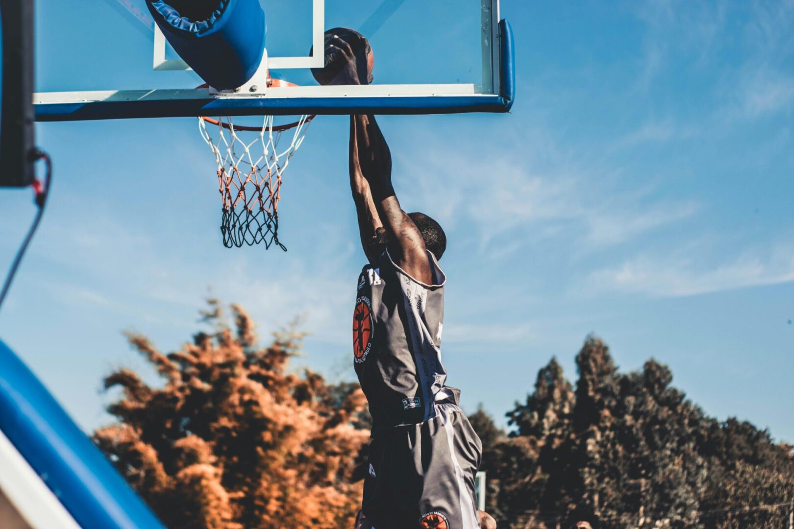 A man is playing basketball on the court