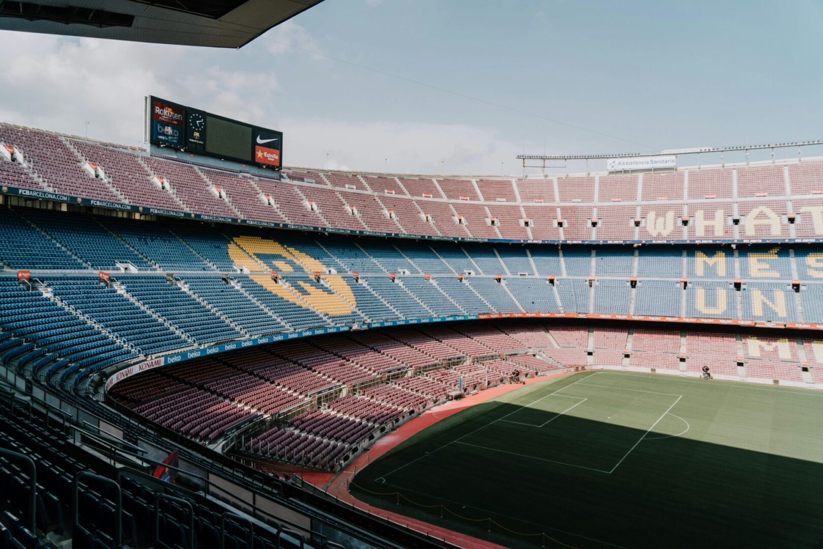 A stadium with many seats and fans in it